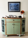 Green cabinet white wall