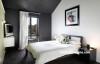 bedroom, black and white bedroom, green feature wall, black bedroom, resene nocturnal 